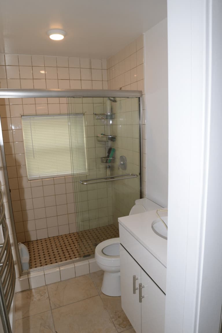 Bathroom — Beige Tiles & Glass Shower